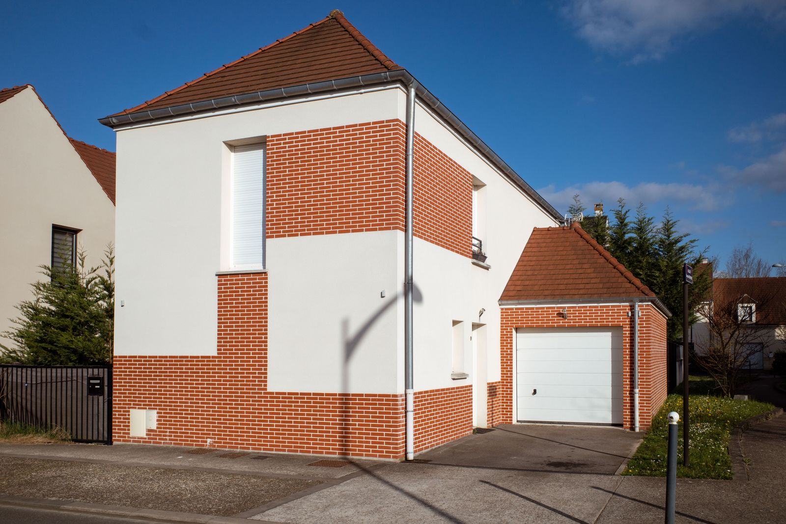 Brick family home on a sunny suburban street