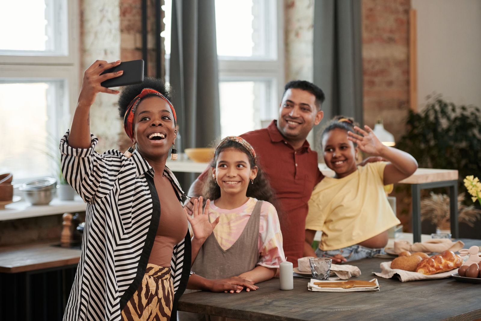 Family taking a selfie together in their kitchen