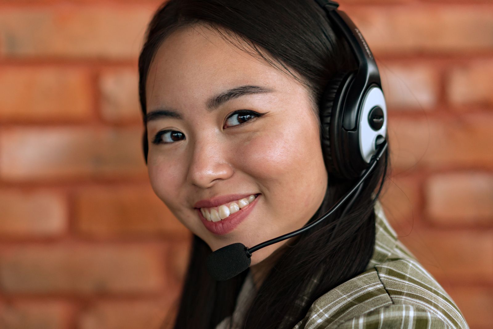 Smiling customer service agent wearing a headset