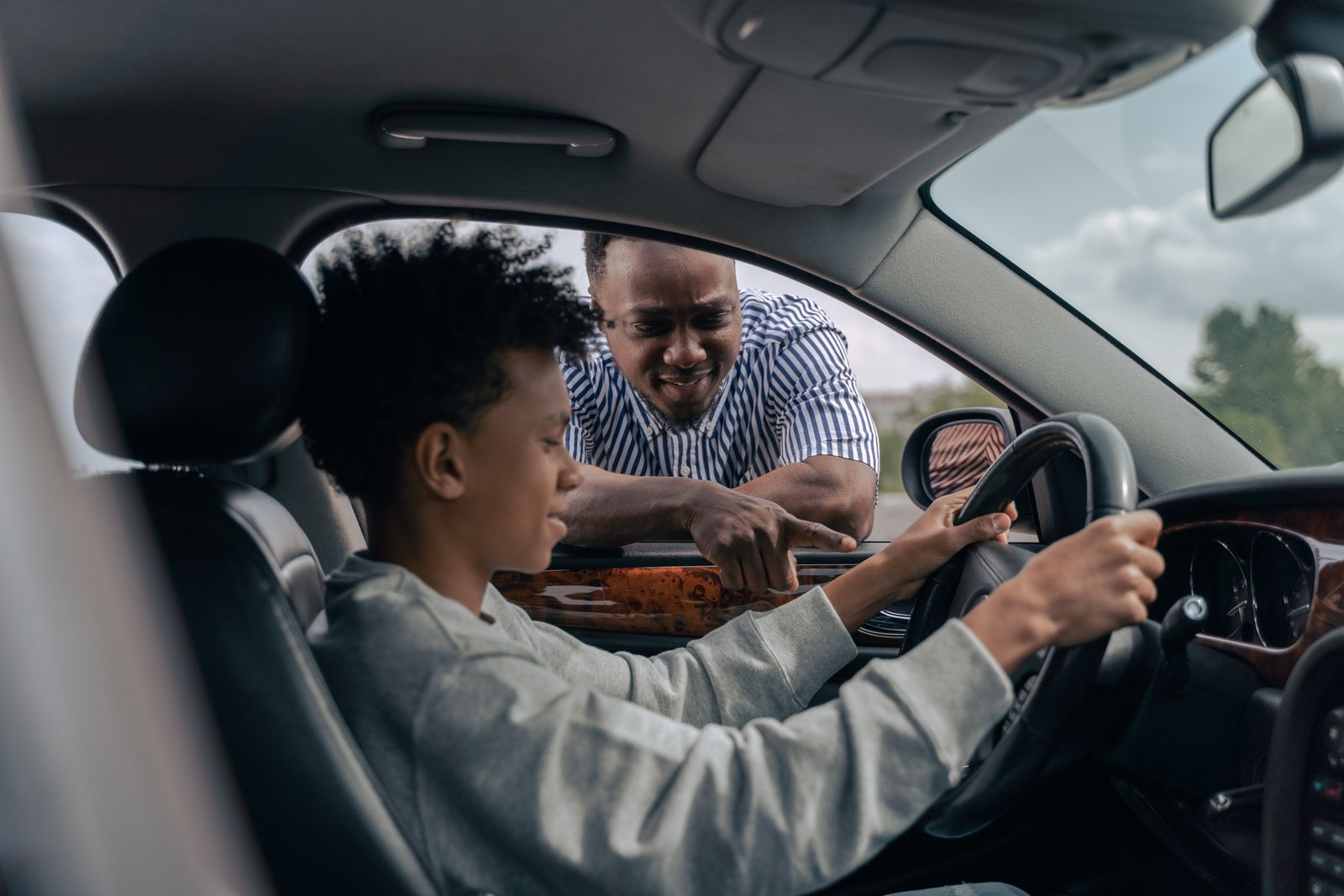 Driver learning safe driving habits with a parent